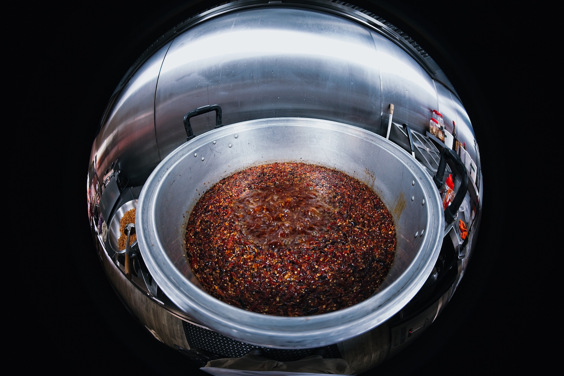 Close-up visual of chilli oil texture. One drizzle and plain food is finished.